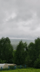 Woman photographed in rural Russian village during cloudy morning