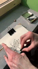 Artist draws beetle while bottle spills in Moscow