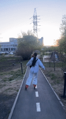 Woman roller skates through Krasnoyarsk park at dusk