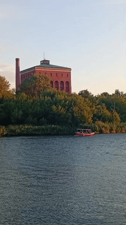 Summer evening along Wrocław's river, campus, and lit streets