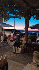 Twilight patio scene captured overlooking water in Tangier