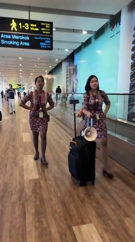 Everyday scenes from Bali's airport during a morning layover