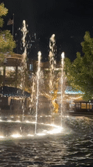 Late-night fountain and lit bookstore observed in Glendale