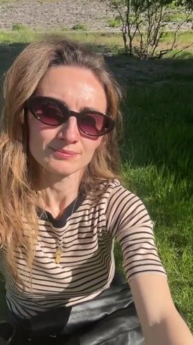 Woman relaxes on grass in Kryvyi Rih park