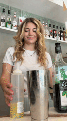 Woman working behind counter in Budva establishment