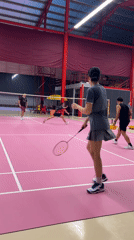 Badminton doubles match played on pink court in Ko Samui