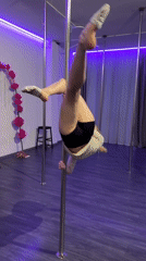 Pole dancing session captured at indoor studio