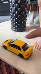 Domestic moments: cat, car selfies, toy interactions captured morning