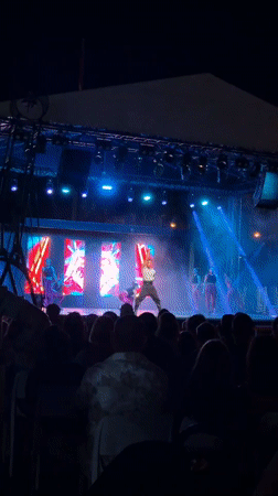 Resort night show: acrobatics, live music, and poolside vibes
