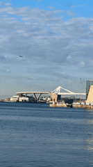 Morning rowers spotted on Barcelona waterfront under cloudy skies