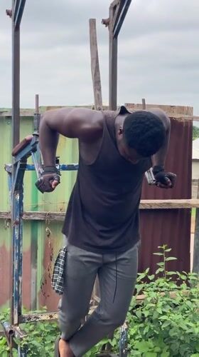 Men exercise with homemade equipment in Akwanga Nigeria