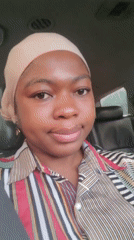 Woman in head covering recorded sitting in car, Nigeria