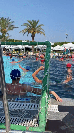 Water polo at a Turkish resort pool, mid-afternoon