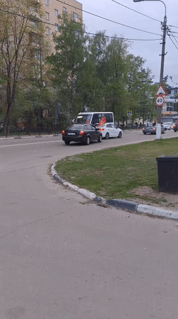 Red-flagged vehicles observed on Elektrostal street during overcast weather