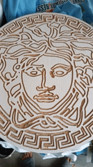 Nigerian Graphic Designer Documents Workspace and Handmade Versace Carving