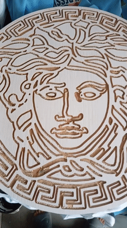 Nigerian Graphic Designer Documents Workspace and Handmade Versace Carving