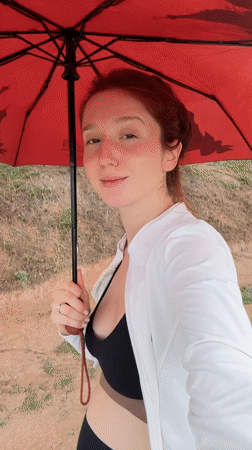 Woman with red umbrella spotted in Choeng Thale
