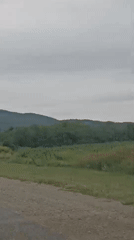 Road-level view of rural fields outside Konstantinovskaya, Russia