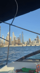 Boat passenger documents Dubai's ongoing skyline development from water