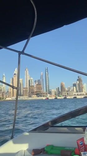 Boat passenger documents Dubai's ongoing skyline development from water