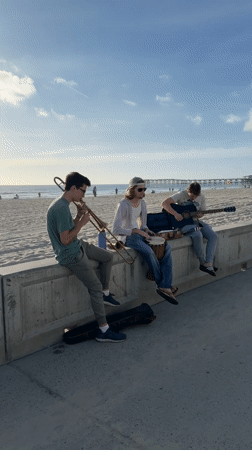 Three musicians perform impromptu beach concert in San Diego