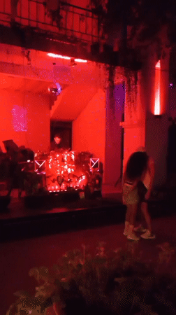 Neon-lit outdoor bar night with DJ, Nha Trang