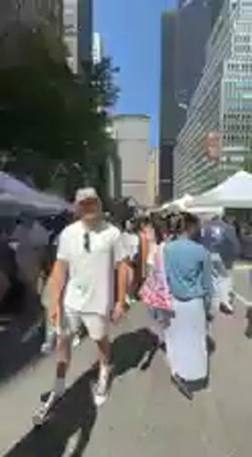 Street market bustles near colorful Love sculpture in NYC