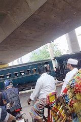 Passenger train passes through Dhaka urban area