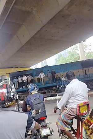 Passenger train passes through Dhaka urban area