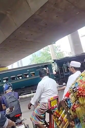 Passenger train passes through Dhaka urban area