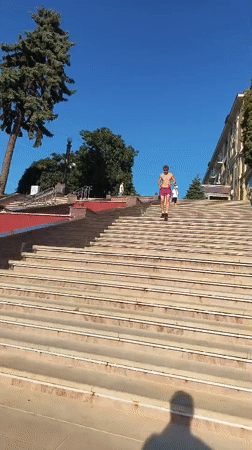 Sunny afternoon at Ternopil's waterfront plaza and staircase