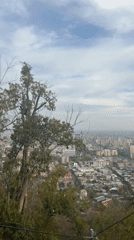 Funicular ride captures Santiago cityscape from hillside vantage point