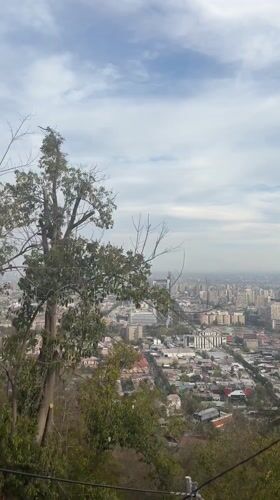 Funicular ride captures Santiago cityscape from hillside vantage point