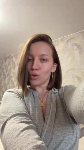 Woman records casual selfies, dramatic sky in Reshetnikovo