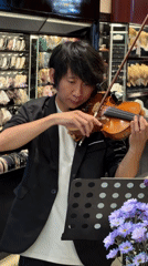 Violinist performs early morning street music in Yuzhong District
