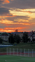 Evening life unfolds in Russian suburb during dramatic sunset