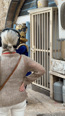 Street performer entertains tourists in historic Jaffa alleyways