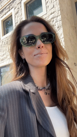 Woman poses in white swimsuit on Budva beach