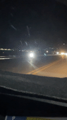 Night drive through wet Davao City streets captured