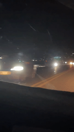 Night drive through wet Davao City streets captured