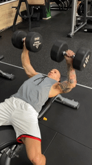 Dumbbell workout on a weight bench in a Pleven gym.