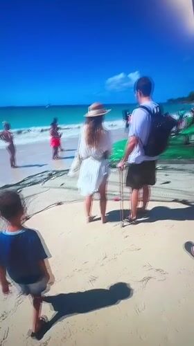 Tourists gather around fishing net at Bulgarian beach