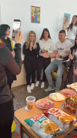 Young adults celebrate birthday with cake and toasts in Zlatograd