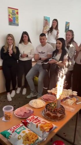 Young adults celebrate birthday with cake and toasts in Zlatograd