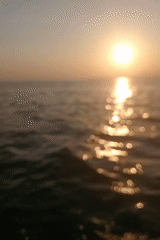Fishing boats at sea off East Java at sunset