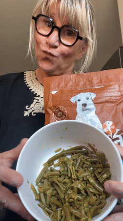 Woman prepares dog food with vegetables in Chambœuf