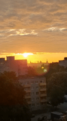 Sunrise illuminates Tallinn skyline in early June morning