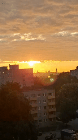 Sunrise illuminates Tallinn skyline in early June morning