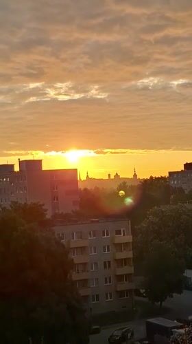 Sunrise illuminates Tallinn skyline in early June morning