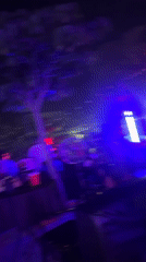 Nighttime party with purple-blue lighting draws crowds in Abuja